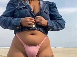 On the beach, she flashed him until he got rock hard, then grabbed and felt his impressive size for herself.