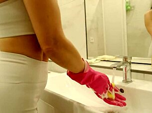 Cleaning lady spreads legs in bathroom