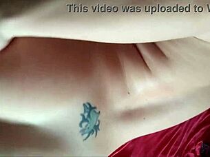 wow, check out this tattooed brunette showing off her natural tits up close!