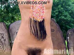 Hairy exotic Latina performs native tribal dance compilation. She flashes small tits and pussy naked in public barefoot.