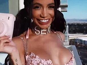 she wore pink lingerie in a teasing display of latina style and sexy clothed appeal