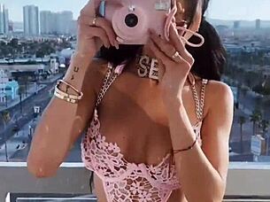 she wore pink lingerie in a teasing display of latina style and sexy clothed appeal