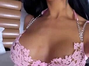 she wore pink lingerie in a teasing display of latina style and sexy clothed appeal