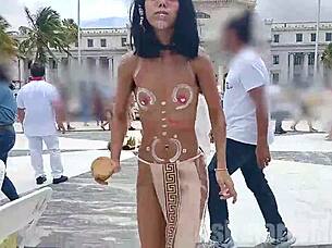 Hairy exotic Latina performs native tribal dance compilation. She flashes small tits and pussy naked in public barefoot.