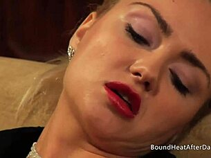 Lesbian slave with collar and leash pushed to lick pussy in bondage domination