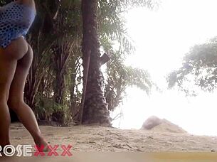 black girl teases playfully on the beach in a homemade couple scene