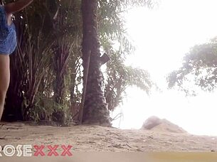 black girl teases playfully on the beach in a homemade couple scene