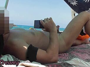 exhibitionist milf handjob big cock on nude beach with cum in front of voyeur