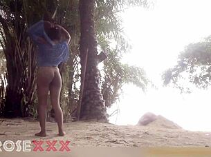 black girl teases playfully on the beach in a homemade couple scene