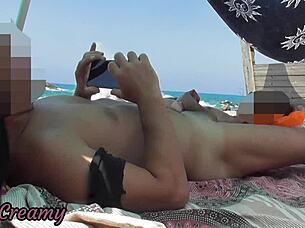 exhibitionist milf handjob big cock on nude beach with cum in front of voyeur