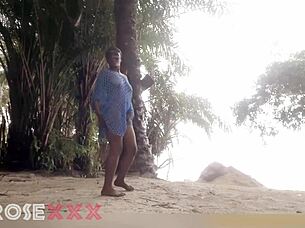 black girl teases playfully on the beach in a homemade couple scene