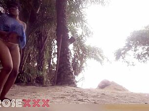 black girl teases playfully on the beach in a homemade couple scene