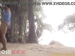 black girl teases playfully on the beach in a homemade couple scene