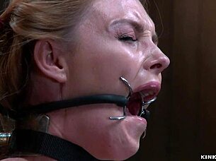 Shackled gagged slut in red stockings endures whipping and vibrator torment