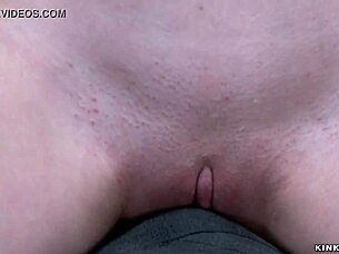 Shackled gagged slut in red stockings endures whipping and vibrator torment