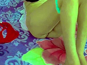 Attractive Indian woman presents appealing features in casual homemade setting