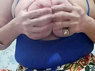 The video dedicated to Tasso features a blonde milf showcasing her big natural tits in a solo performance.
