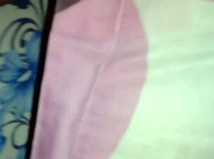 Someone explores using a sex toy for personal pleasure in a simple setting.