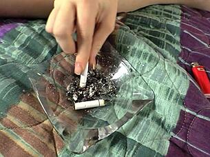 sadie kenney smokes while fingering her shaved pussy in solo session