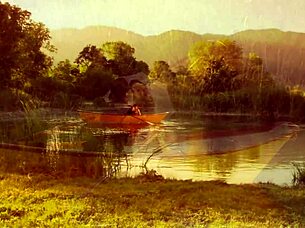 A beautiful girl with small features rode alongside a strong man on a boat