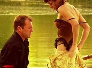 A beautiful girl with small features rode alongside a strong man on a boat