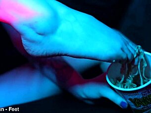 Whoa, check out these sexy feet totally crushing those cup noodles in a wild femdom vibe! 😏👣