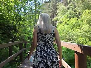 Sweet girl uses remote controlled device in park and reaches peak excitement