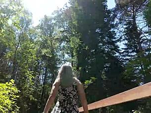 Sweet girl uses remote controlled device in park and reaches peak excitement