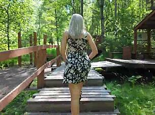 Sweet girl uses remote controlled device in park and reaches peak excitement