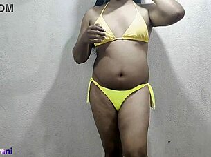 hey, check out this hot indian shemale in a lime bikini crossdressing solo, teasing with big tits and ass in part 1 of her homemade anal play