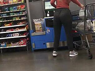 blonde milf struts in tight spandex highlighting her curvy figure and confident style during casual day out