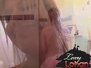 Blonde Lexy Lohan with natural tits takes a steamy shower while fingering her wet pussy to orgasm.
