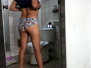 Boss's girl films herself stripping naked in bathroom with curvy ass shaking