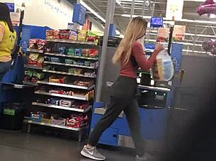 blonde milf struts in tight spandex highlighting her curvy figure and confident style during casual day out