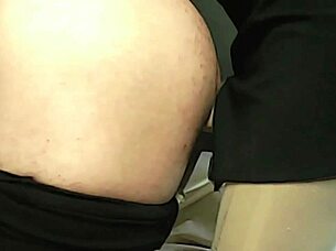 Brunette engages in harness pegging role play with boyfriend in feminine attire.