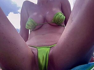 check out italian milf artemisia love flashing her shaved pussy in tight bikini at public beach
