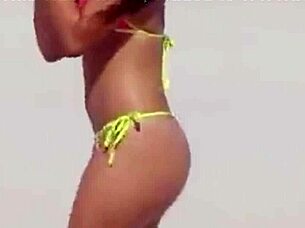 omg, check this unbelievable young girl in a micro bikini chilling on the beach with her boyfriend's relatives 😍🏖️