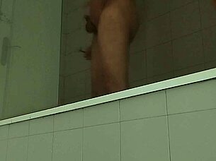 oh man, check out this delicious guy shaving his massive cock!