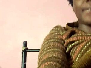 In a quiet setting, the solo ebony girl explores her feelings of excitement alone