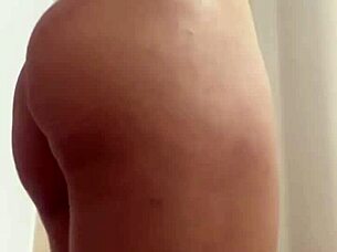 Attractive woman dances funk wearing white transparent shorts for fun