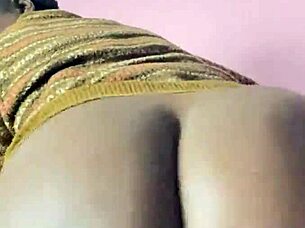 In a quiet setting, the solo ebony girl explores her feelings of excitement alone