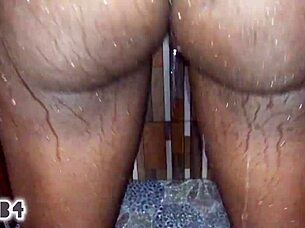 Amateur black couple enjoys bent over doggystyle sex in bathroom with cumshot