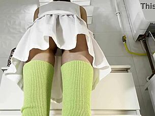 Hot brunette college girl flashes panties under mini tennis skirt in bathroom.