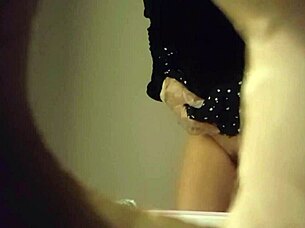 Hidden Cam Captures Sexy Babe Peeing in Toilet