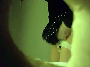 Hidden Cam Captures Sexy Babe Peeing in Toilet