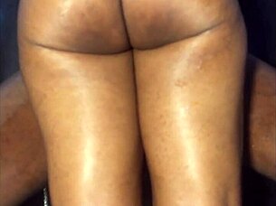 In the bedroom, this ebony girlfriend gets a thigh fuck with intense handjob and fingering. She screams from the passionate amateur action on the bed.