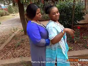 African Milf Lesbians Kissing Outdoors at Party