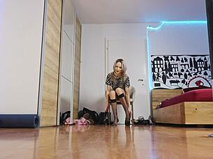 Glamorous blonde in short hair struts high heels