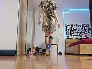 Glamorous blonde in short hair struts high heels