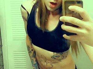 hot tranny in satin lingerie touches her small cock and clit seductively